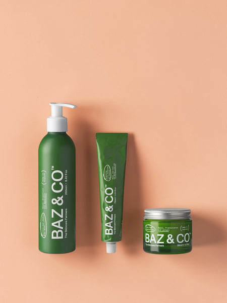 Baz & Co Skincare BAZ Bundle: body wash, exfoliator, and moisturiser in green bottles and jars.