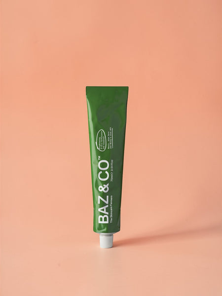Baz & Co Skincare Brightening 2-in-1 Exfoliator & Cleanser tube with Basil, Aloe Vera & Apple Cider Vinegar.