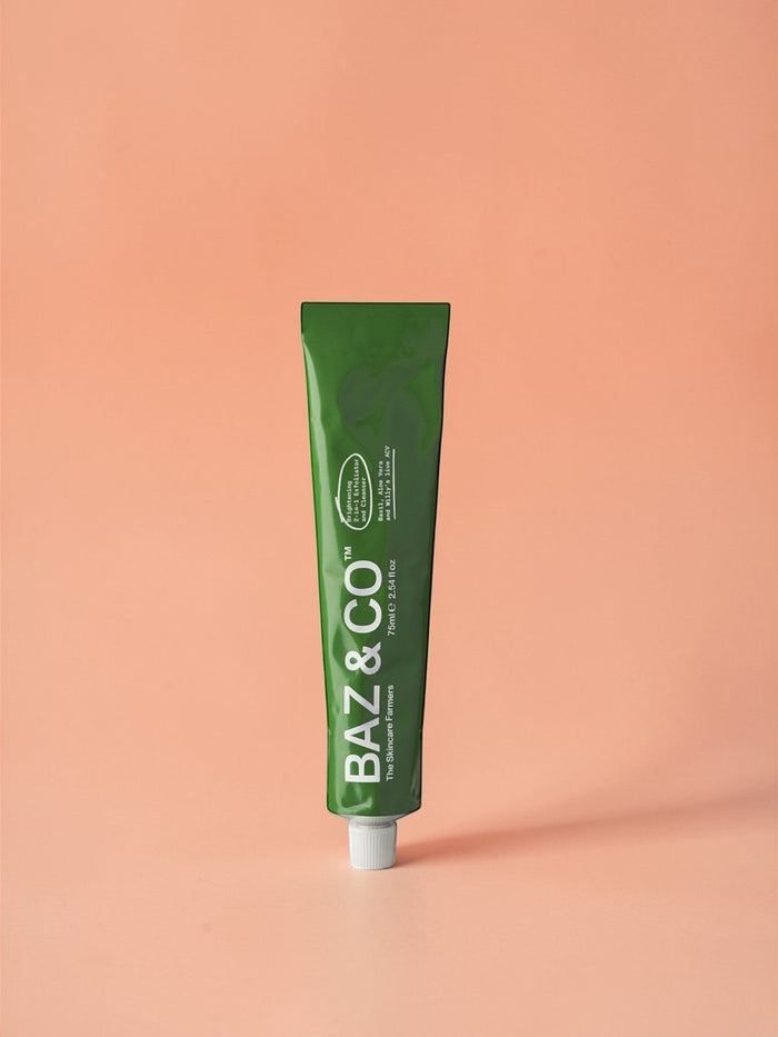 Baz & Co Skincare green tube of 75ml Brightening 2-in-1 Exfoliator & Cleanser with Basil, Aloe Vera & Apple Cider Vinegar.