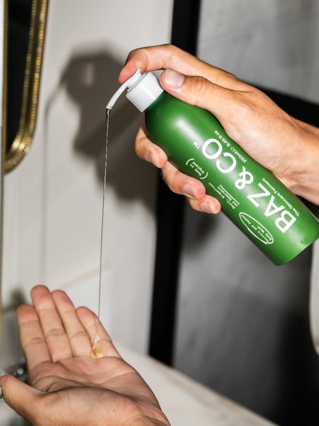 Baz & Co Skincare BAZ Bundle Plus set with Restore & Awaken Body Wash being dispensed into a hand.