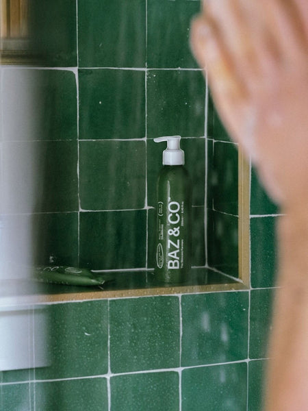 Baz & Co Skincare Restore and Awaken concentrated body wash in a green bottle with a pump dispenser.